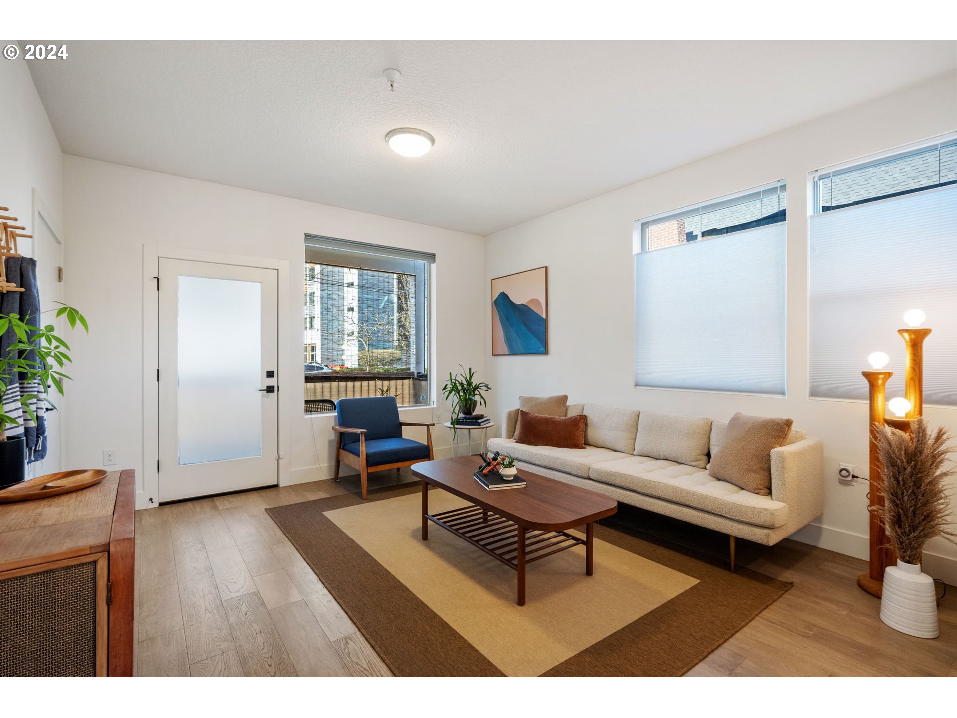 1616 Northeast 45th Avenue, Unit 1 Portland, OR 97213 - Photo 5 of 30 a living room with furniture and a wooden floor
