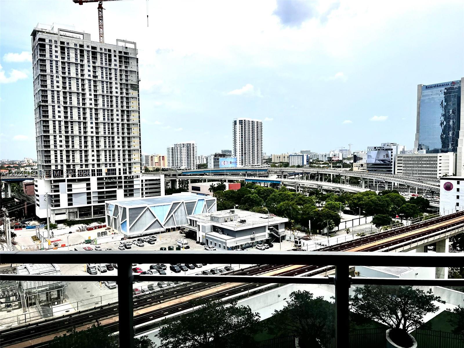 90 Southwest 3rd Street, Unit 1409 Miami, FL 33130 - Photo 6 of 25 a view of a balcony with chairs