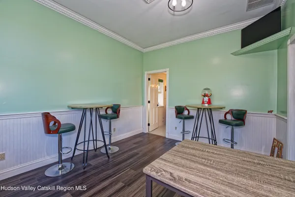 a bedroom with a bed and a table in it