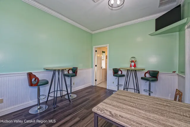 a bedroom with a bed and a table in it