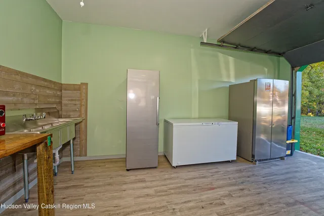 a kitchen with stainless steel appliances a refrigerator and a stove