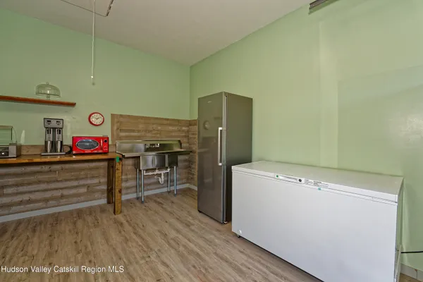 a view of storage and utility room with washer and dryer
