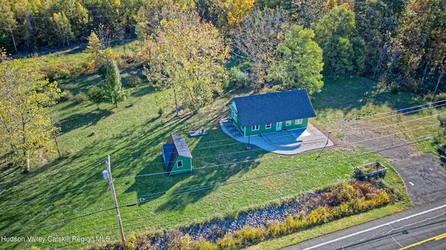 a view of a garden with a house