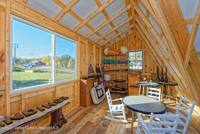 a front view of a house with outdoor seating