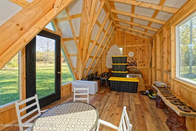 a backyard of a house with outdoor seating