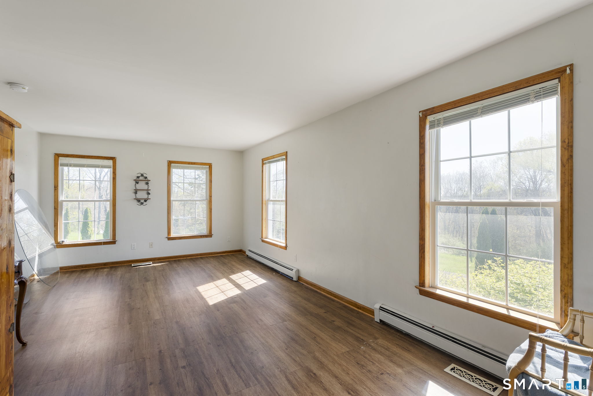 341 High Street Extension Thomaston, CT 06787 - Photo 30 of 39 a view of an empty room with wooden floor and a window