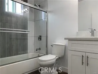 a bathroom with a toilet a sink and shower