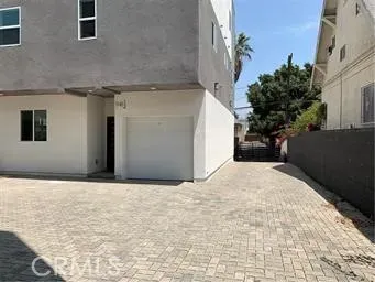 a view of garage with a refrigerator