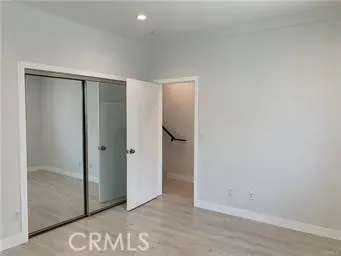 an empty room with closet area