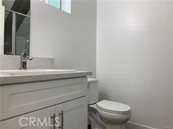 a bathroom with a toilet and a sink