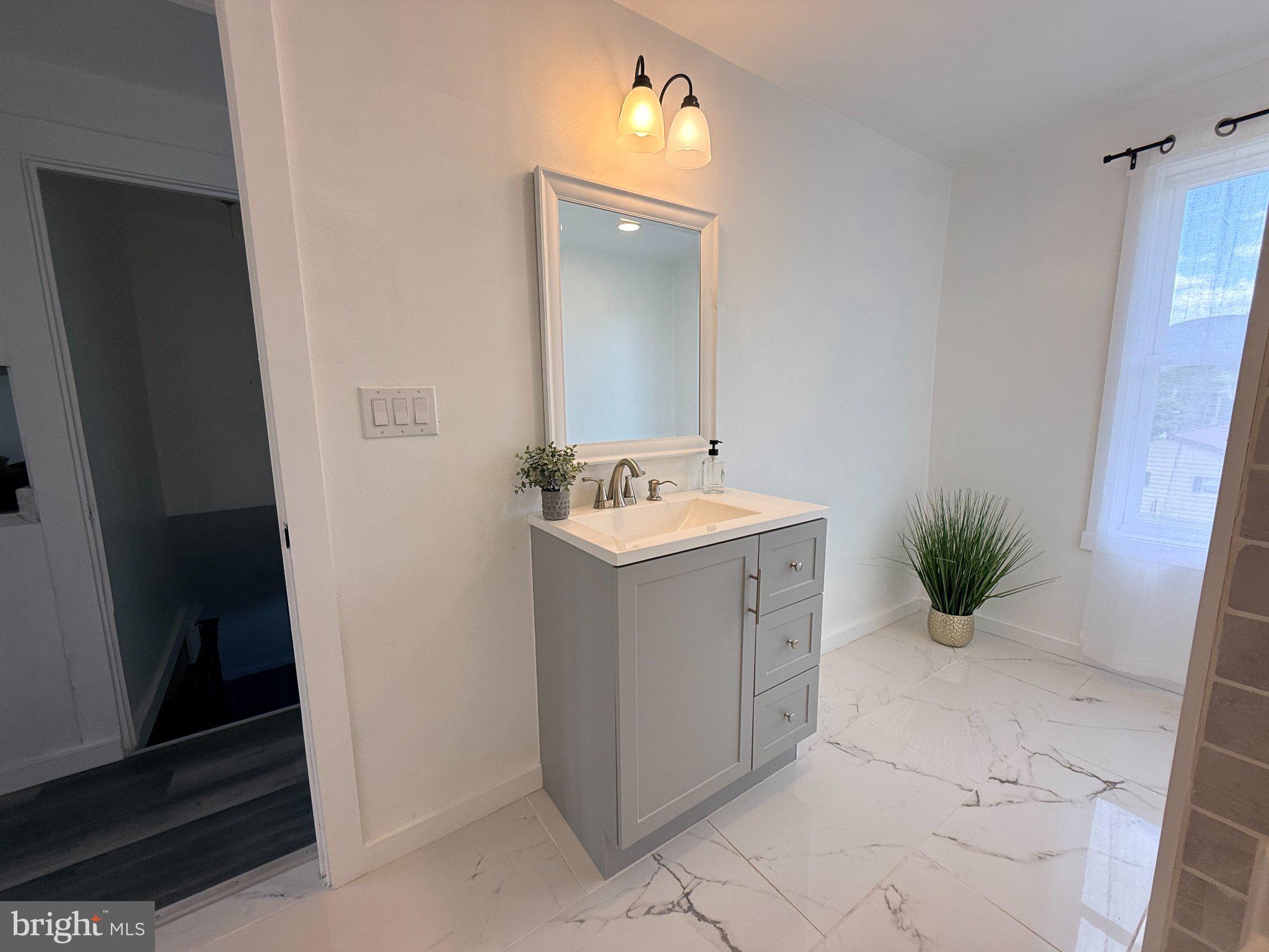 385 Herr Street Lock Haven, PA 17745 - Photo 16 of 25 Modern elegance in a bright bathroom.
