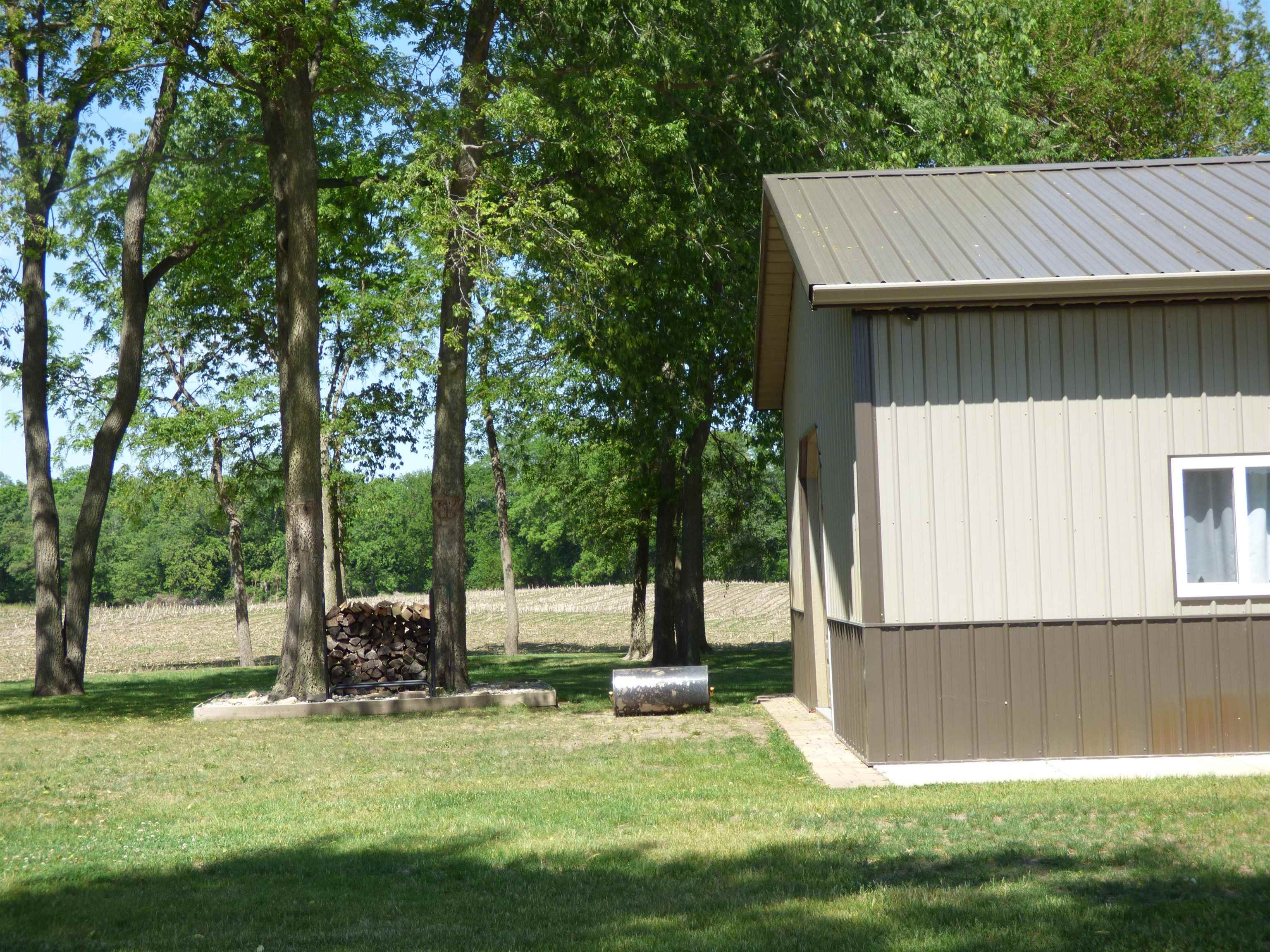 6384 A Diehl Road Savanna, IL 61074 - Photo 9 of 32 a view of a house with backyard and sitting area