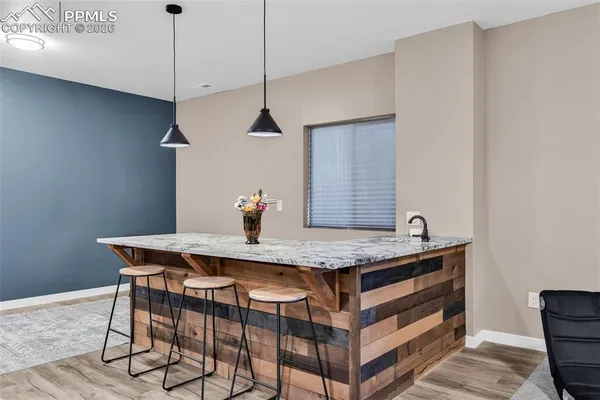 a view of a table and chairs in the kitchen