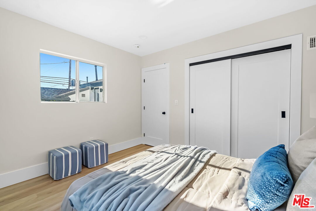 3492 Cabrillo Boulevard Los Angeles, CA 90066 - Photo 24 of 59 a bedroom with bed and wooden floor