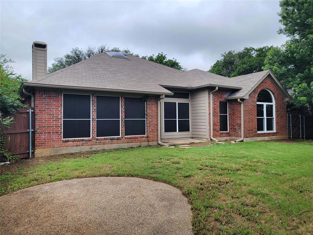 1604 Knoll Ridge Circle Corinth, TX 76210 - Photo 32 of 37 Brick exterior featuring a gabled roof and arched window