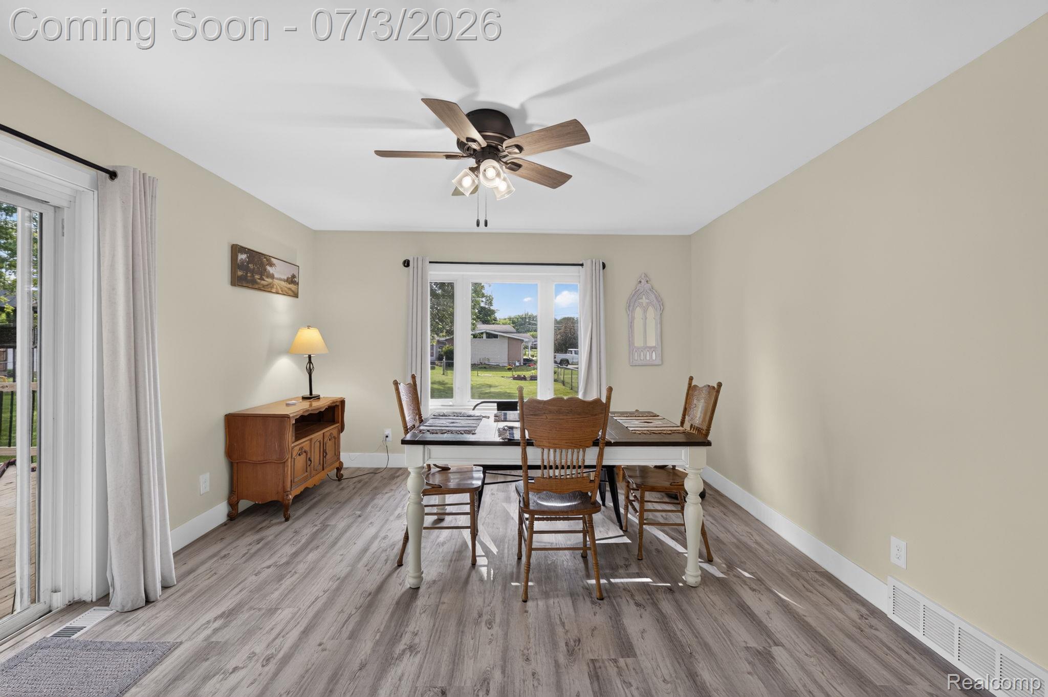 5355 North Seymour Road Flushing, MI 48433 - Photo 14 of 41 Spacious room featuring wood-finish flooring, light-toned walls, and a ceiling fan with integrated lighting