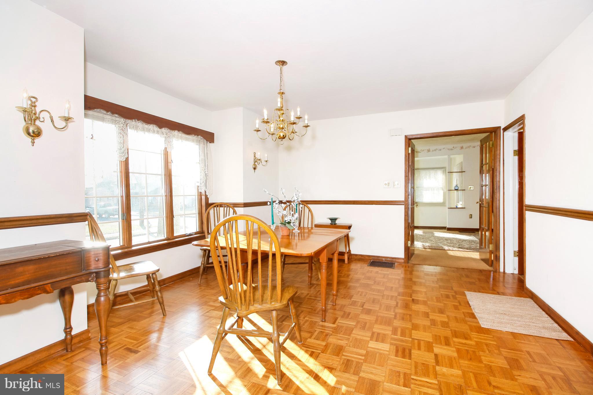 401 Georgetown Road Glassboro, NJ 08028 - Photo 20 of 64 a view of a dining room with furniture a chandelier and wooden floor