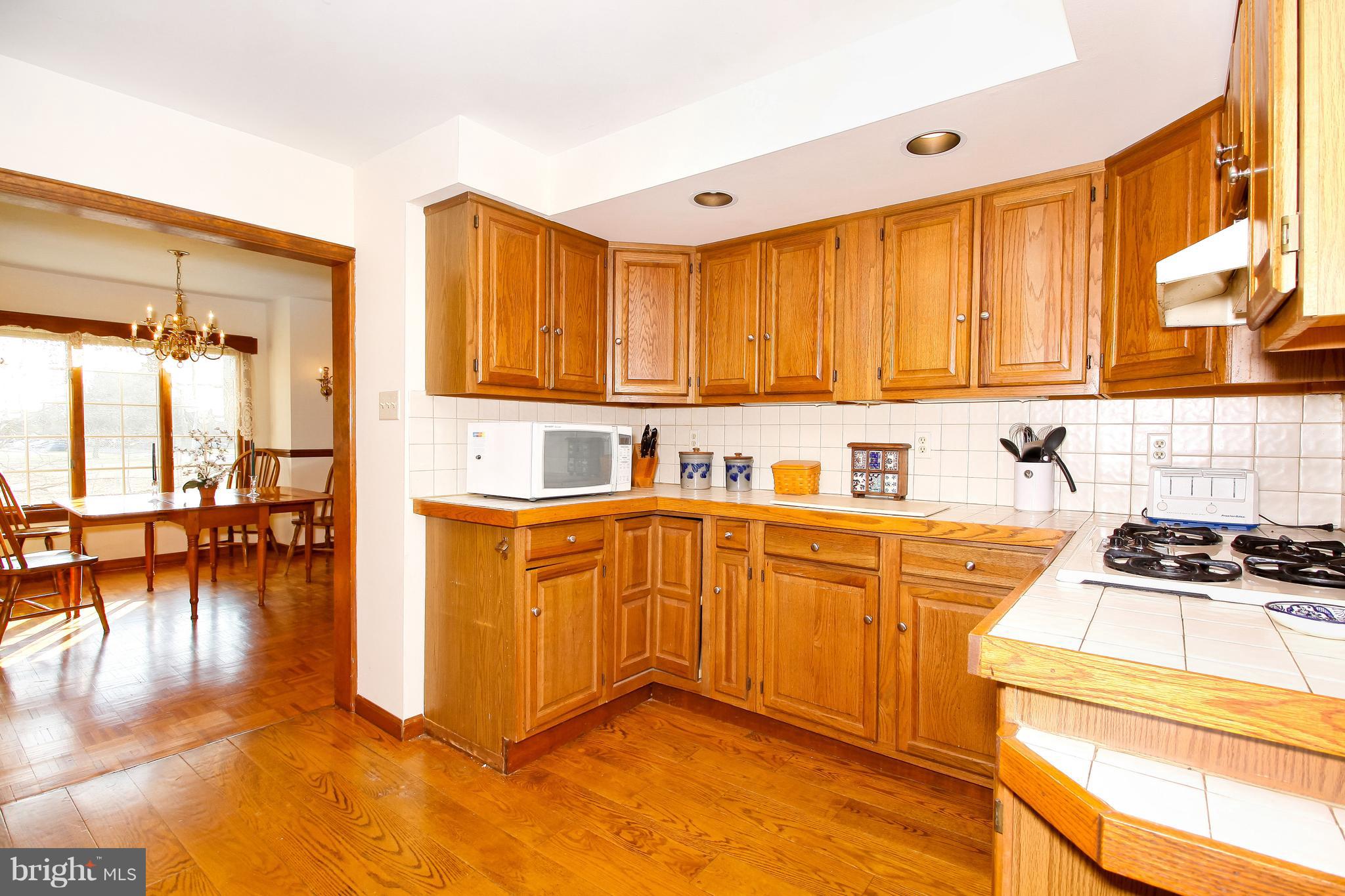401 Georgetown Road Glassboro, NJ 08028 - Photo 22 of 64 a kitchen with stainless steel appliances granite countertop a stove a sink and a microwave