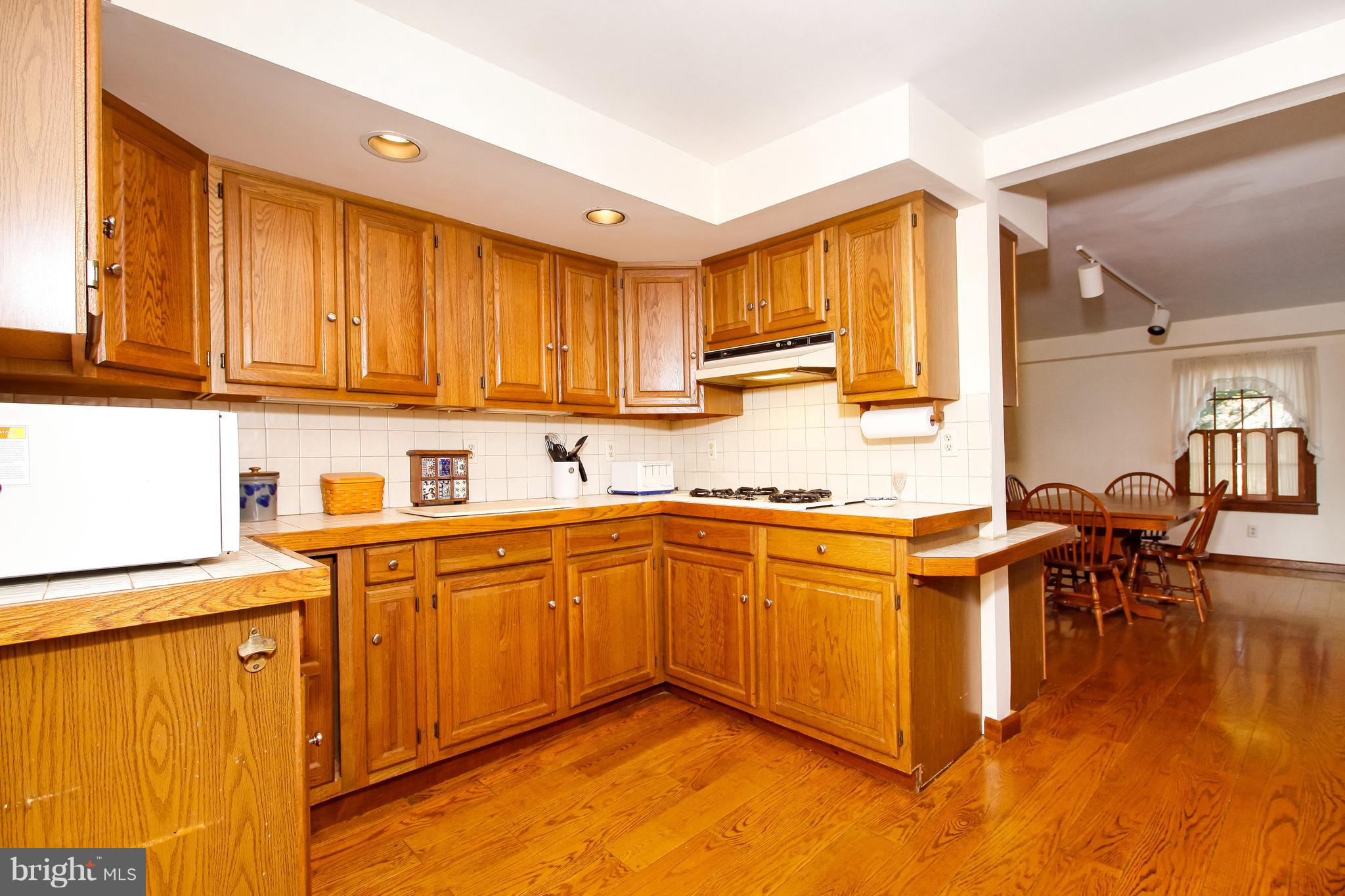 401 Georgetown Road Glassboro, NJ 08028 - Photo 23 of 64 a kitchen with stainless steel appliances granite countertop sink stove and cabinets