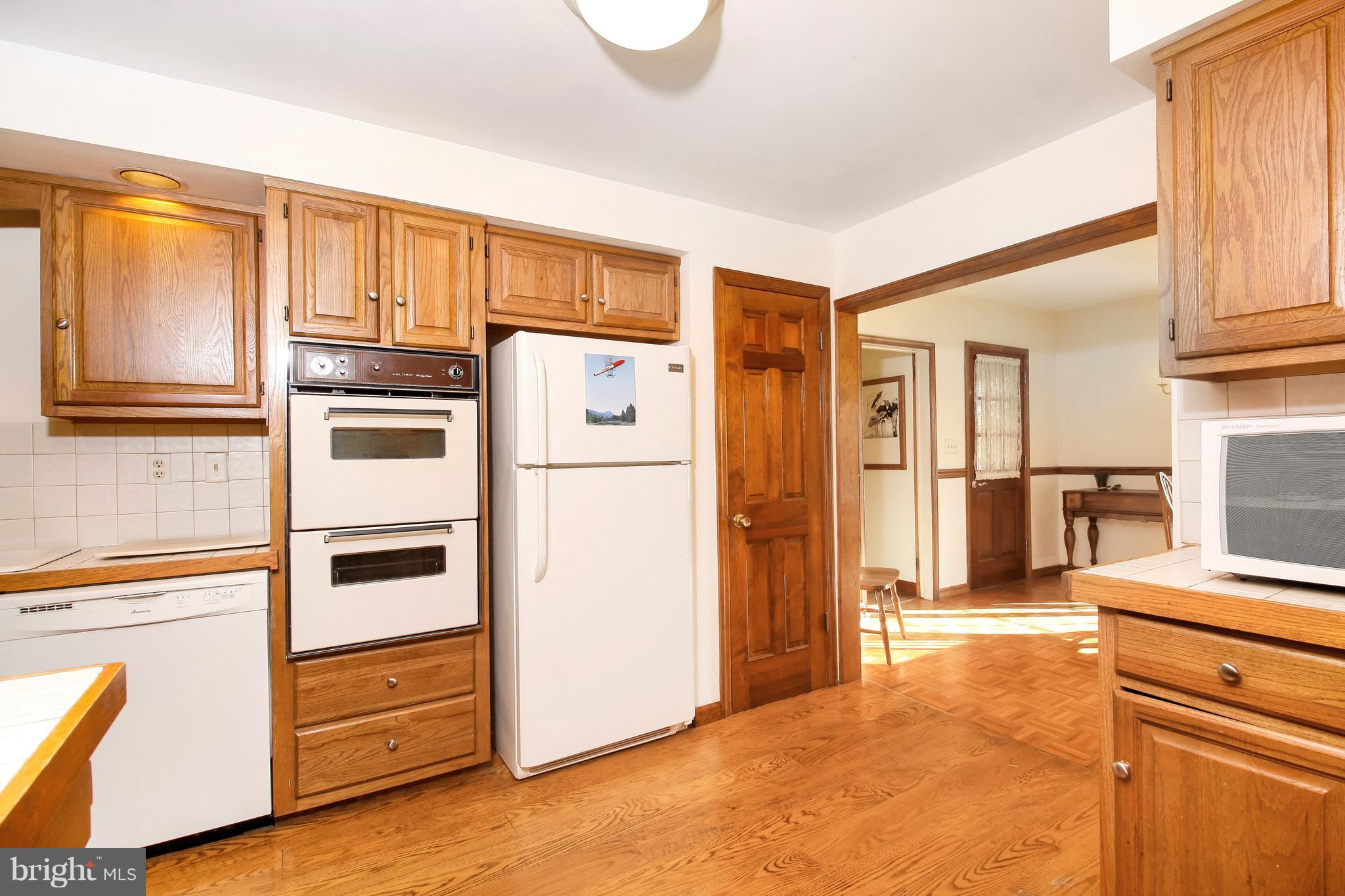401 Georgetown Road Glassboro, NJ 08028 - Photo 24 of 64 a kitchen with stainless steel appliances granite countertop a refrigerator and a stove top oven