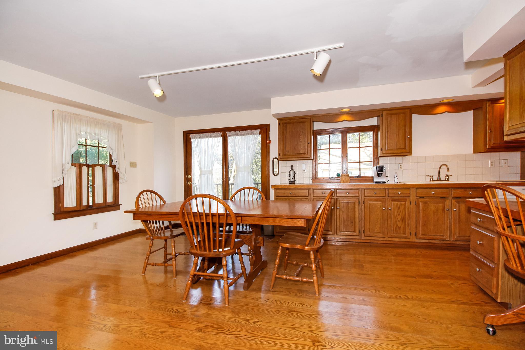 401 Georgetown Road Glassboro, NJ 08028 - Photo 29 of 64 a view of a dining room with furniture and wooden floor