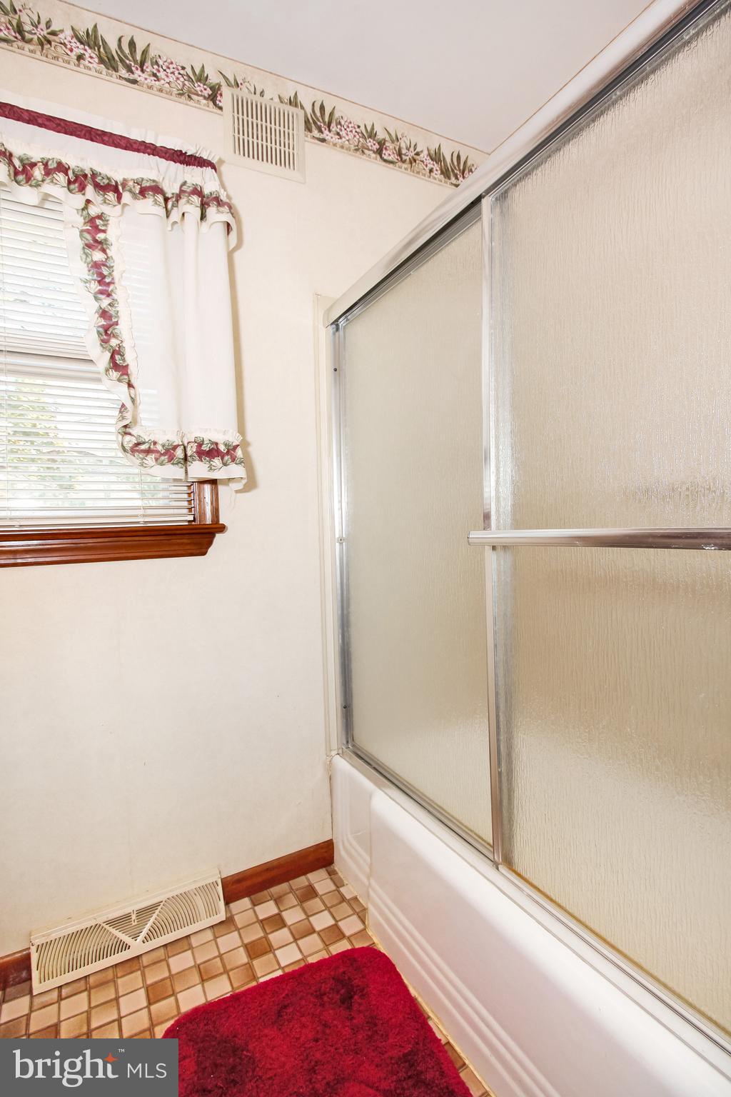 401 Georgetown Road Glassboro, NJ 08028 - Photo 39 of 64 a bathroom with a shower and a window