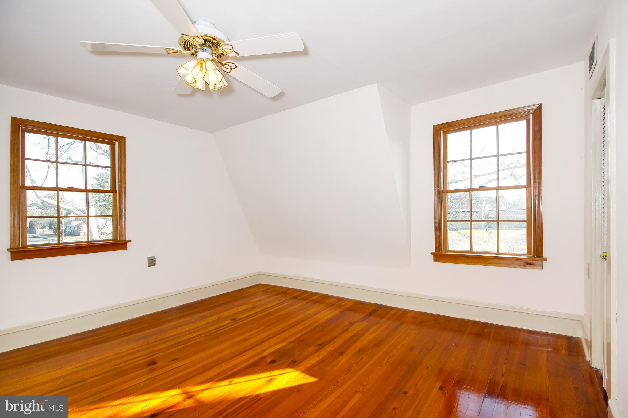 401 Georgetown Road Glassboro, NJ 08028 - Photo 45 of 64 a view of an empty room with wooden floor and a window