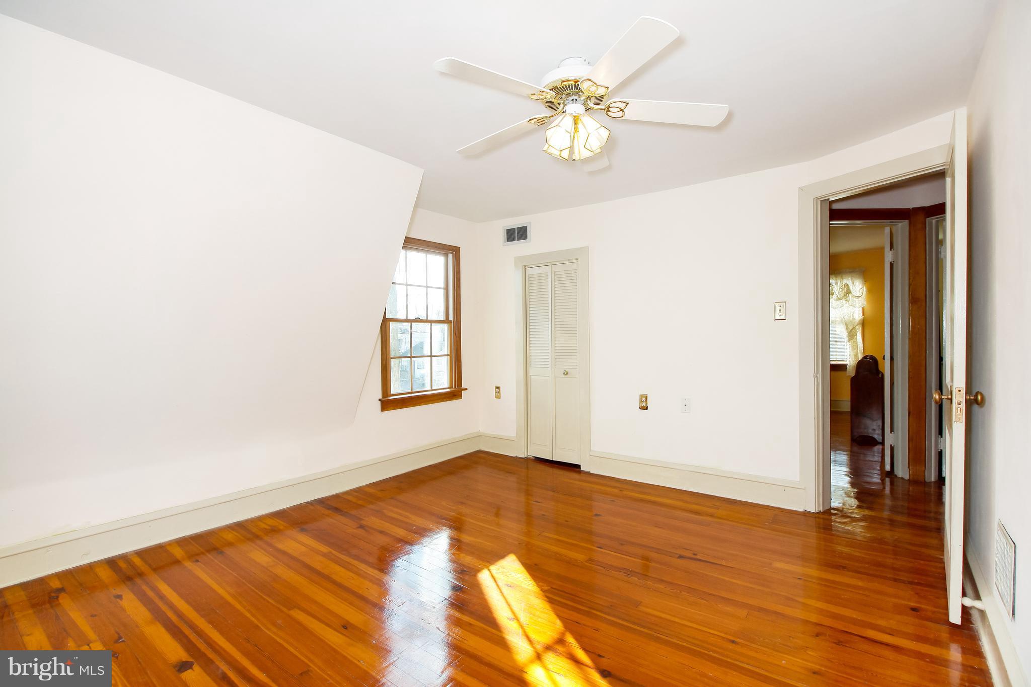 401 Georgetown Road Glassboro, NJ 08028 - Photo 46 of 64 a view of empty room with wooden floor and fan