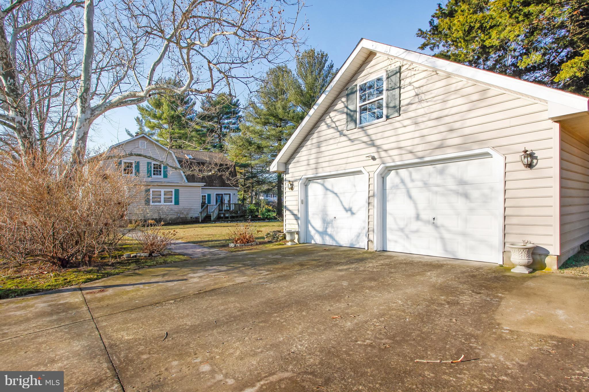 401 Georgetown Road Glassboro, NJ 08028 - Photo 6 of 64 a view of a house with a yard and garage