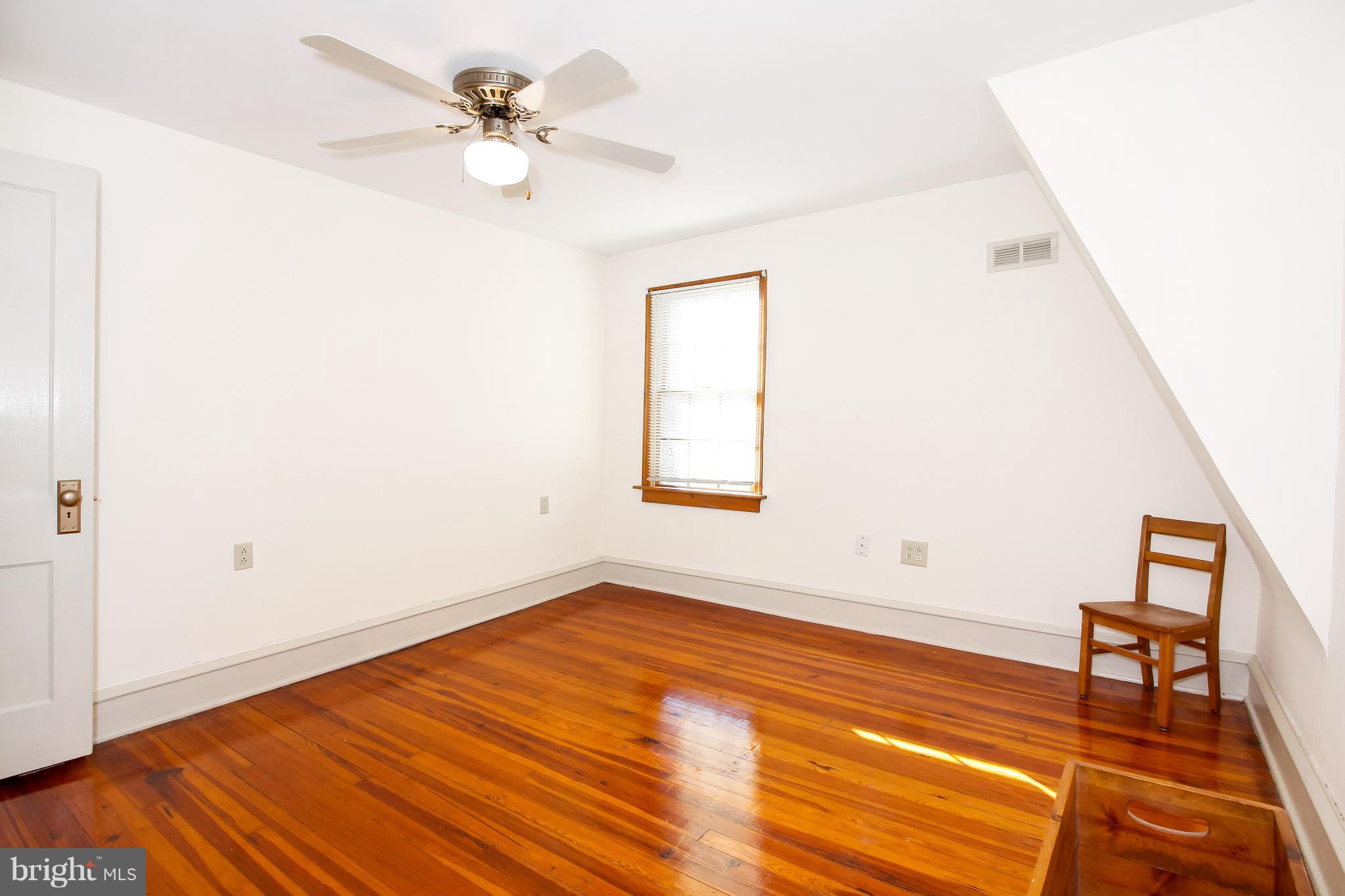 401 Georgetown Road Glassboro, NJ 08028 - Photo 56 of 64 an empty room with a window and a ceiling fan