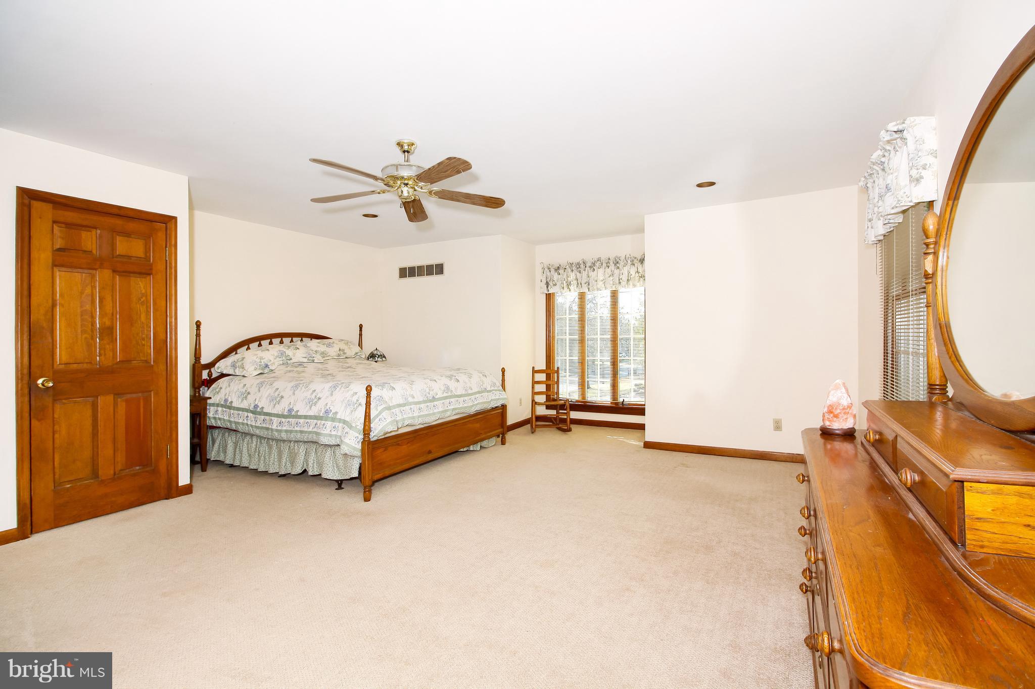 401 Georgetown Road Glassboro, NJ 08028 - Photo 62 of 64 a spacious bedroom with a bed and a window