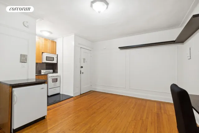 a view of kitchen with furniture and wooden floor