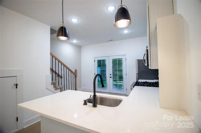a kitchen with sink and window