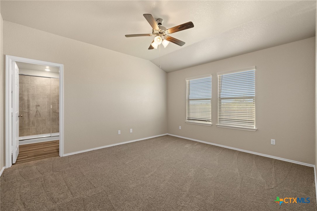 922 Stone Vly Road Temple, TX 76502 - Photo 12 of 32 an empty room with windows and fan