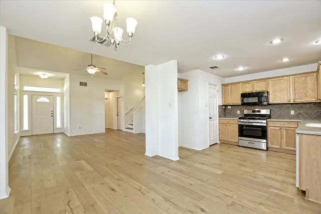 a view of kitchen with cabinets and stainless steel appliances