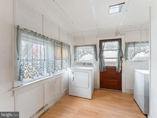 a kitchen with a refrigerator and a stove