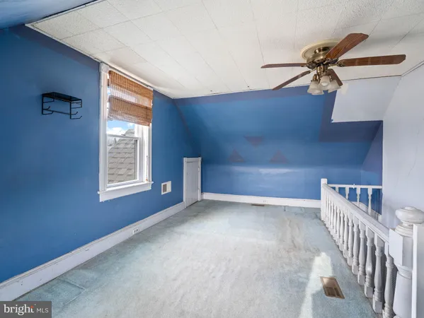 a view of a hallway with windows