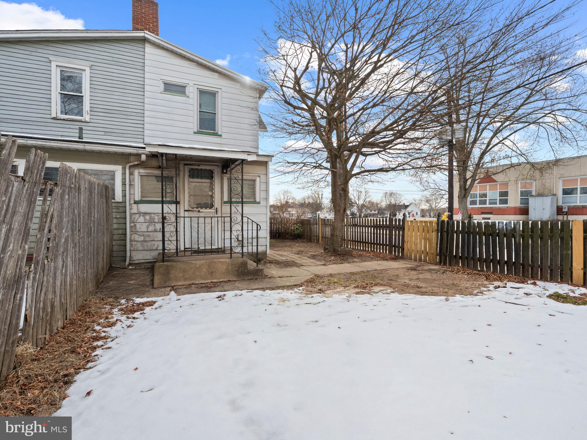 700 Chestnut Street Delanco, NJ 08075 - Photo 26 of 31 a view of a white house with wooden fence next to a road