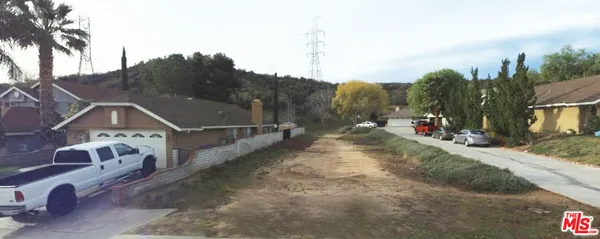 a view of a street with a building in the background
