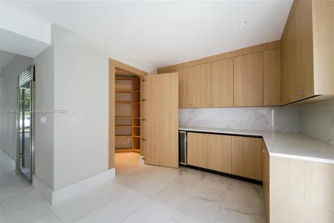 a view of a bathroom with a shower and a sink