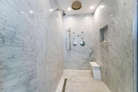 a view of walk in closet with wooden floor