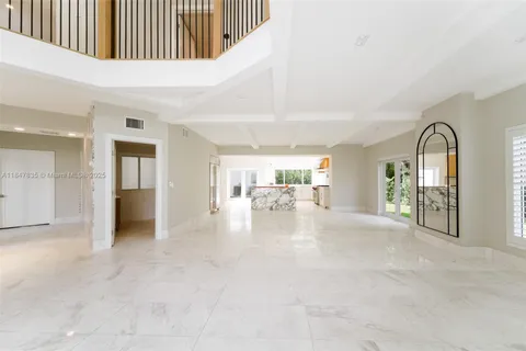 a view of a big room with closet and windows