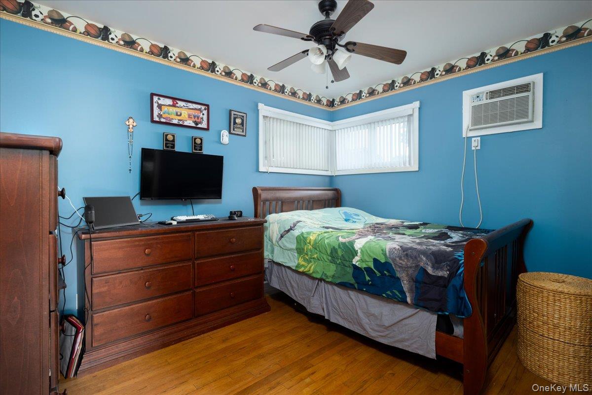 11 Adelphi Road Hicksville, NY 11801 - Photo 14 of 26 a bedroom with bed and a flat screen tv