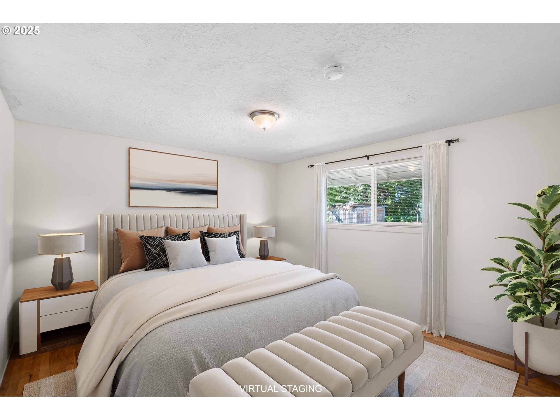 3285 Northeast 5th Street Gresham, OR 97030 - Photo 15 of 35 a bedroom with a large bed and a potted plant