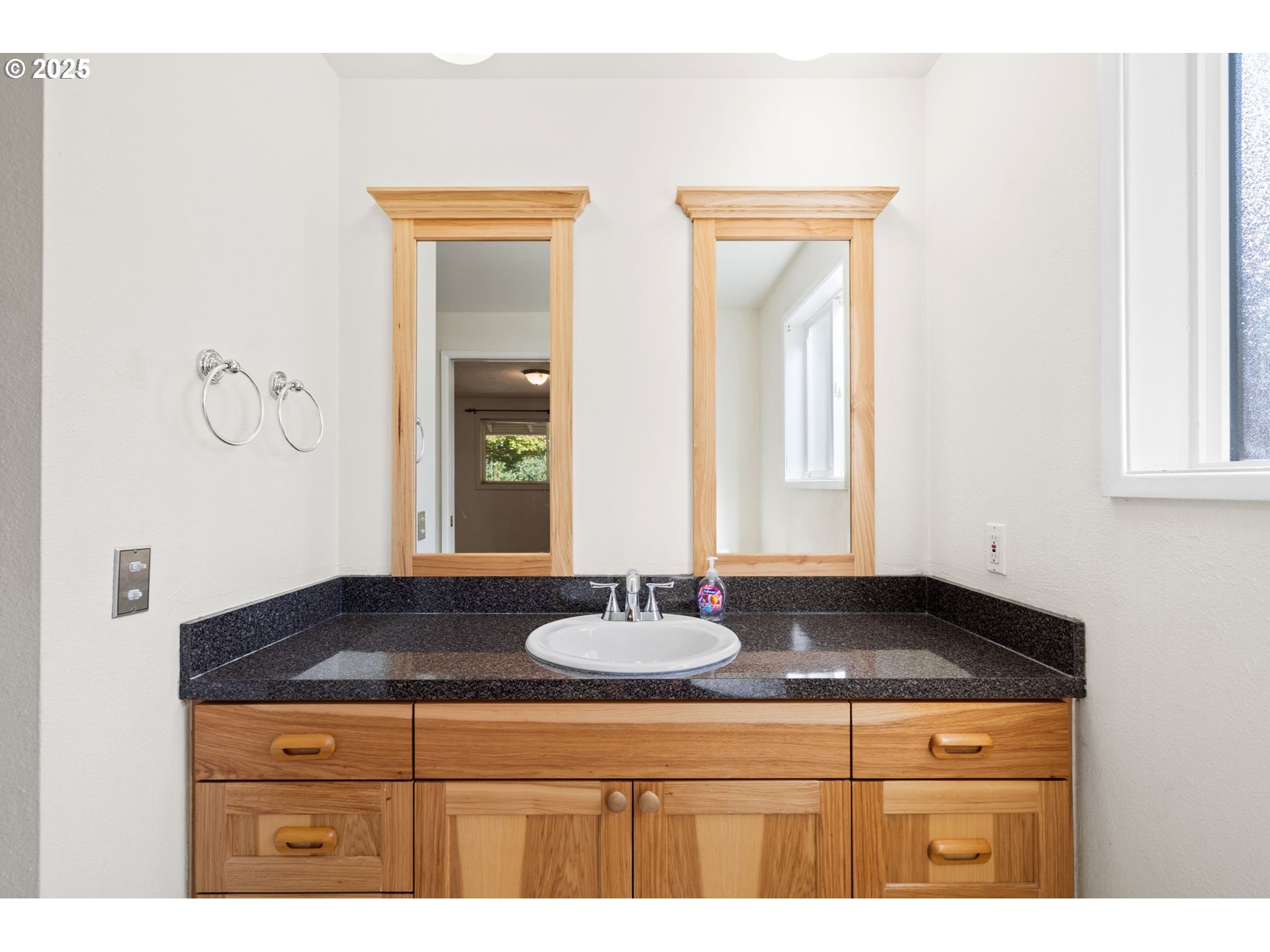 3285 Northeast 5th Street Gresham, OR 97030 - Photo 17 of 35 a bathroom with a sink and a mirror