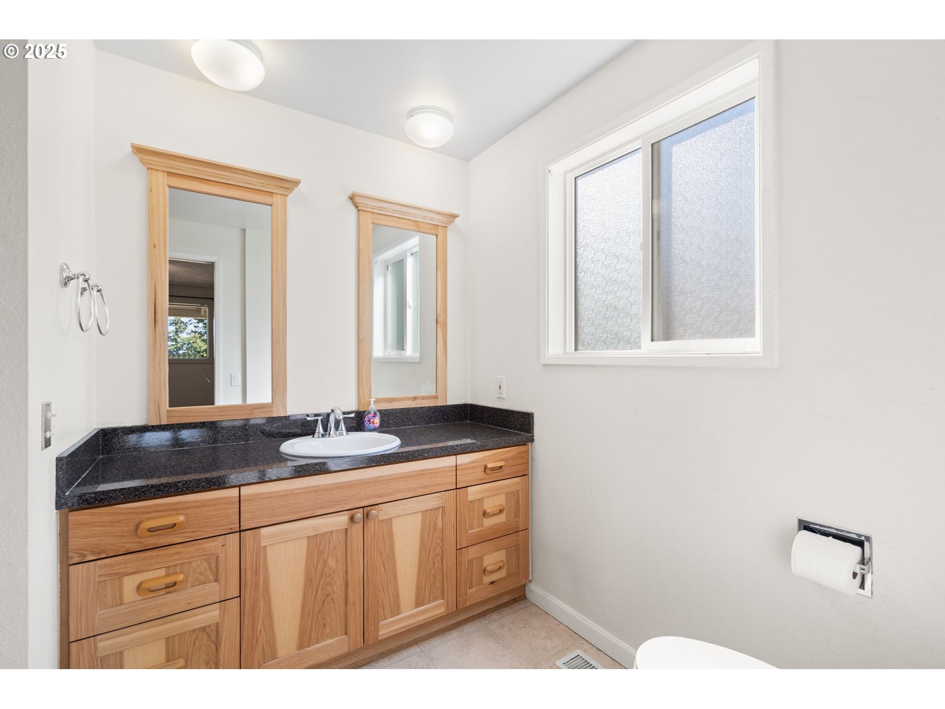 3285 Northeast 5th Street Gresham, OR 97030 - Photo 18 of 35 a bathroom with a granite countertop sink and a mirror