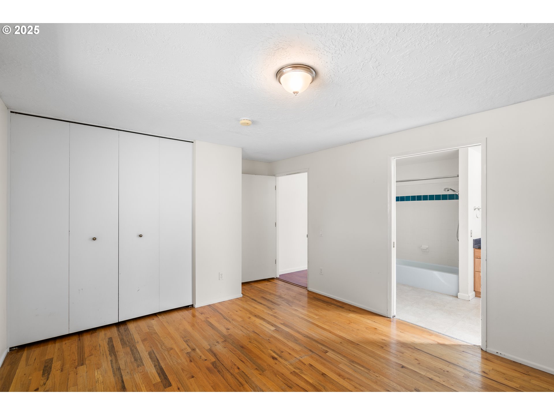 3285 Northeast 5th Street Gresham, OR 97030 - Photo 19 of 35 a view of an empty room with wooden floor