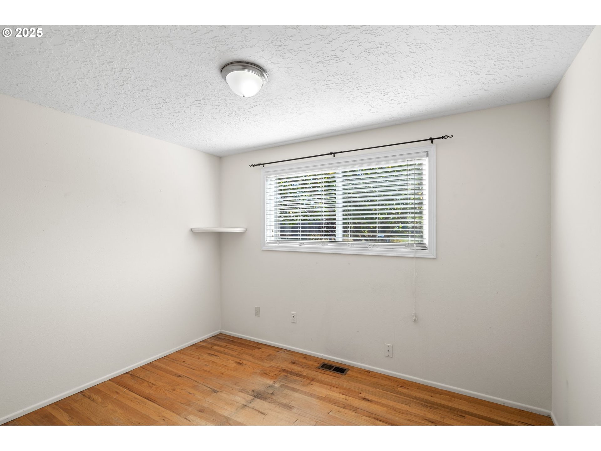 3285 Northeast 5th Street Gresham, OR 97030 - Photo 23 of 35 a view of an empty room with a window