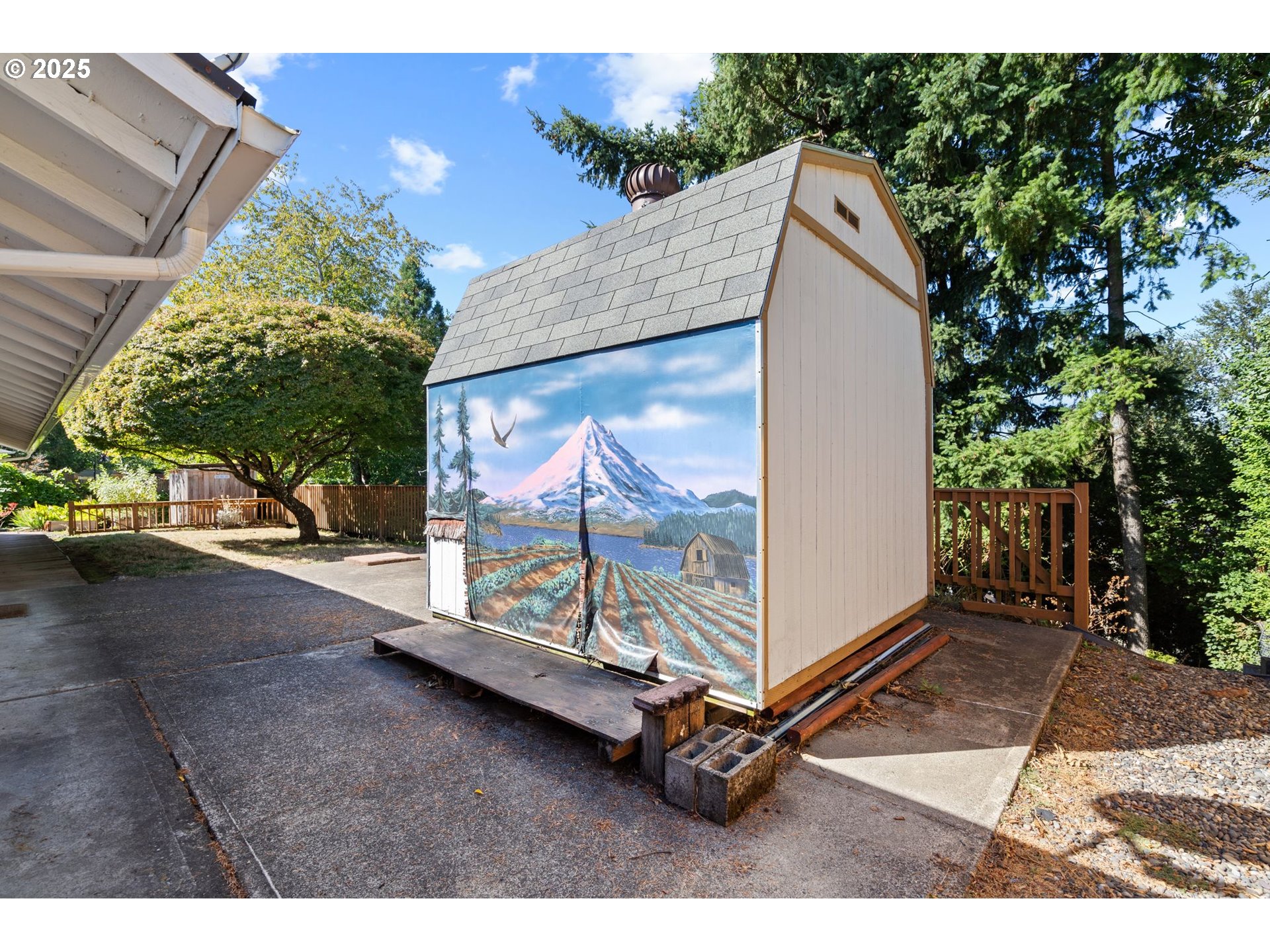 3285 Northeast 5th Street Gresham, OR 97030 - Photo 29 of 35 a view of backyard with a white wall and potted plants