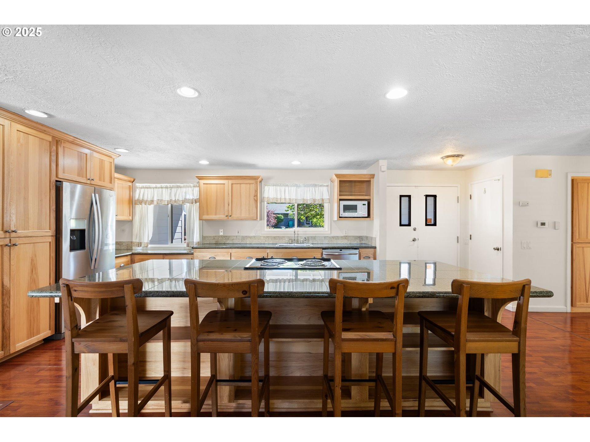 3285 Northeast 5th Street Gresham, OR 97030 - Photo 5 of 35 a view of a dining room with furniture and a large window